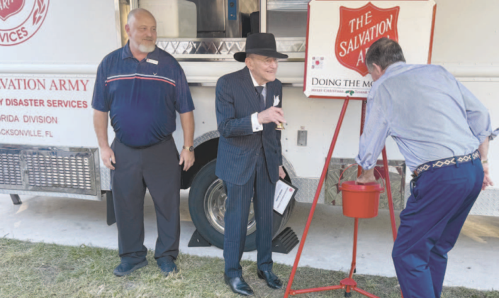Richard Thompson, Buddy Jacobs and Geoff McKisson kick off the Salvation Army’s Red Kettle campaign. Jacobs rang the ceremonial first bell. Nick Blank/News-Leader