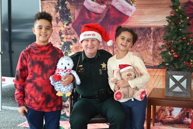 Submitted photo / Nassau County Sheriff Bill Leeper greets children during NCSO's Santa with a Cop event.