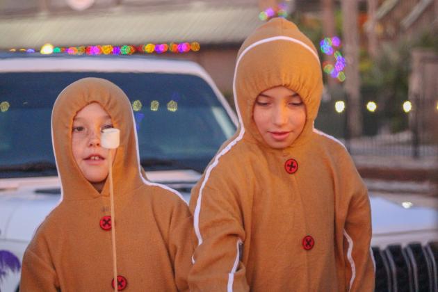 Photos by Marisa DeMar/News-Leader Kids enjoy the S'mores provided by the Fernandina Pirates Club at the City of Fernandina Beach Christmas Tree Lighting on Nov. 28.