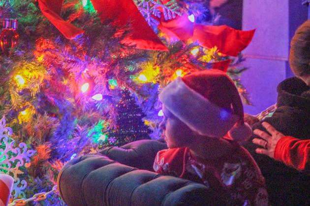 Kids enjoy the festivities at the city Christmas tree lighting.