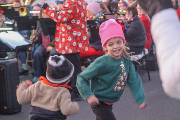 Kids enjoy the festivities at the city Christmas tree lighting.