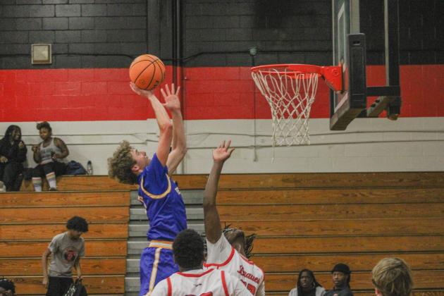 Reid Webber drives to the net
