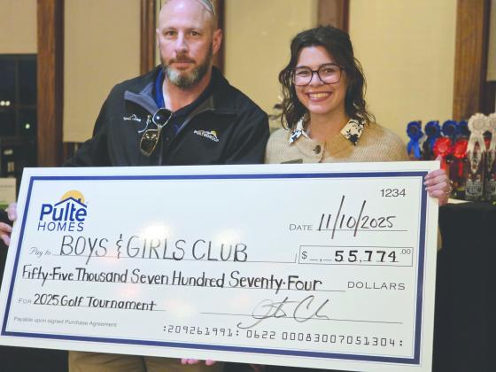 Justin Cook, division president for Pulte and Emily Friedman, director of administration for BGCNCF.