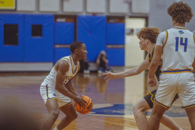 The boys varsity basketball teams from Fernandina beach and Yulee high school faced off in Fernandina Beach on Dec. 5. Photo by Ashley Chandler/News-Leader