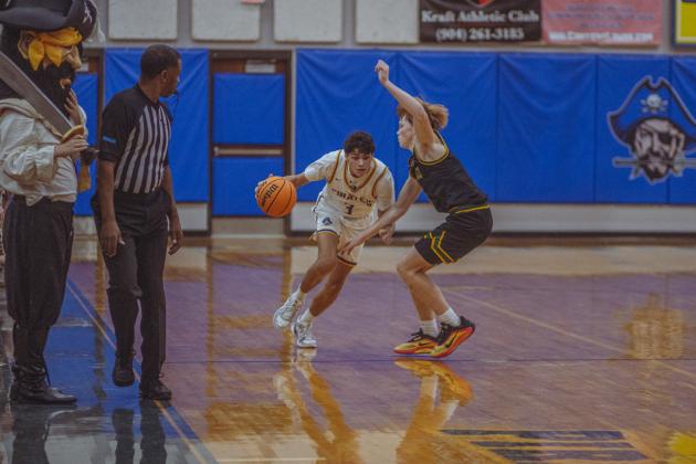 The boys varsity basketball teams from Fernandina beach and Yulee high school faced off in Fernandina Beach on Dec. 5. Photo by Ashley Chandler/News-Leader