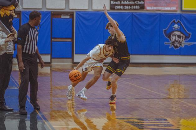 The boys varsity basketball teams from Fernandina beach and Yulee high school faced off in Fernandina Beach on Dec. 5. Photo by Ashley Chandler/News-Leader