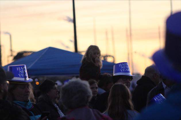 The Shrimp Drop crowd waits in front of the shrimp with festive attire. By Marisa DeMar/News-Leader