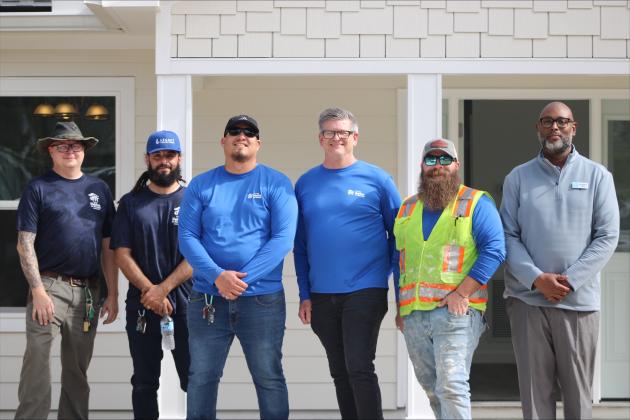  Octavious Carr the Vice President of Construction for First Coast Habitat for Humanity and the crew at the new home they built in Fernandina Beach. By Marisa DeMar/News-Leader 