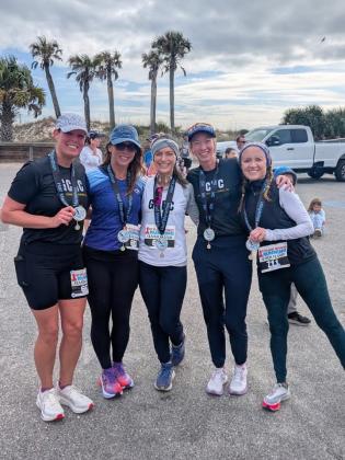 Jessica Macdonald, Melanie Waits, Melody Mandrick, Dana Cameron, Kathleen Mullen pose together after completing the Cannon Ball Half Marathon Run on Jan 3. Submitted photo