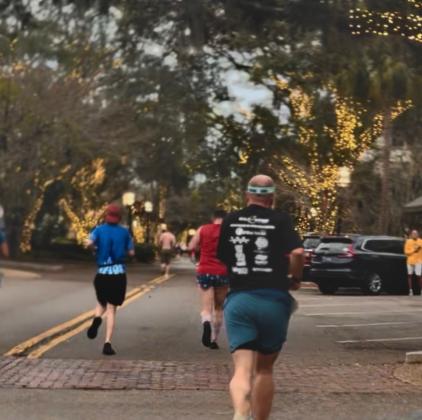 Participants of the Cannon Ball race run through Centre Street in downtown Fernandina Beach on Jan 3. Submitted photo