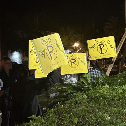 Demonstrators outside the city comission meeting Tuesday night. Marisa DeMar/News-Leader