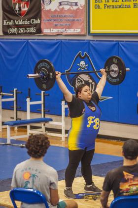 Lady Pirate Makayla Carnley lifts at a competition against West Nassau on Jan. 6 at Fernandina Beach High School. Photo by Ashley Chandler/News-Leader