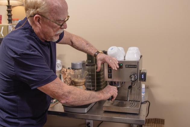 Gil Johnston makes a cappuccino with beans roasted minutes prior.