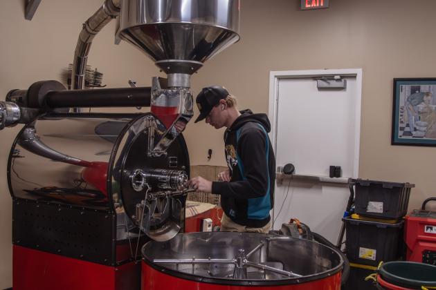 Jacob Schlehr roasts coffee beans with "Rosita the Red Roaster" at Nuanz Coffee Roasters in Yulee. Photos by Ashley Chandler/News-Leader