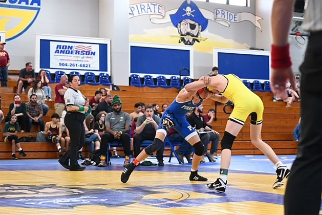 Pirate wrestler Tristan Holmes competes against Hornet wrestler Sebastian Windsor at the District Duals.  Submitted photo