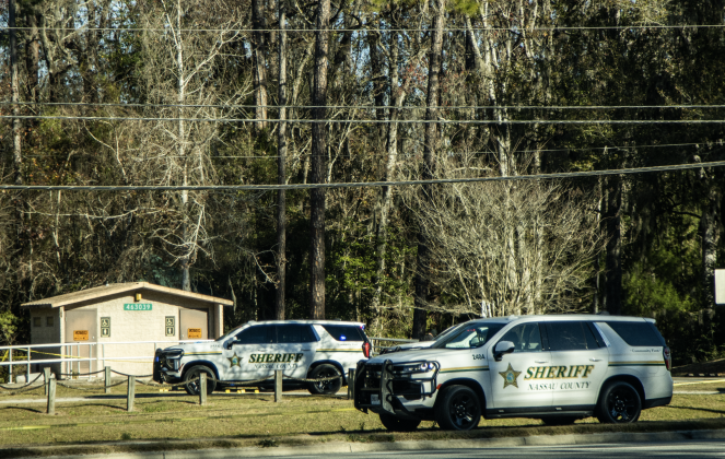 Nassau County Sheriff's Office deputies and investigators Friday morning at John Muir Ecological Park. Ashley Chandler/News-Leader