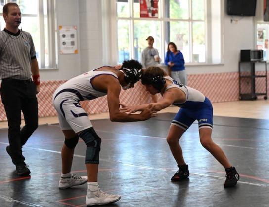 Adam Wilson competes for FBHS wrestling over winter break. Photos courtesy of Eric Kubatzke