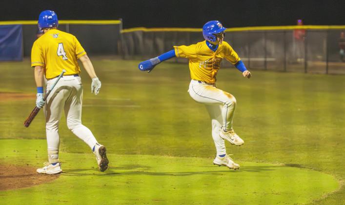 Dalton Janey, right, celebrates scoring a run.. Photo by Ashley Chandler/News-Leader
