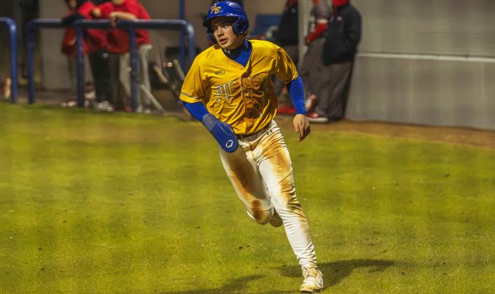 Dalton Janey, right, celebrates scoring a run.. Photo by Ashley Chandler/News-Leader