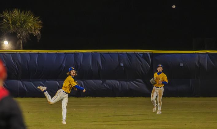 Landen Holbrook throws the ball from the outfield on Feb. 13. Photo by Ashley Chandler/News-Leader