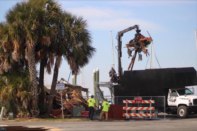 Demolition began Tuesday of Atlantic Seafood in Downtown Fernandina Beach. Photo by Marisa DeMar/News-Leader