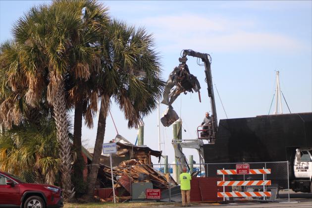 Demolition began Tuesday of Atlantic Seafood in Downtown Fernandina Beach. Photo by Marisa DeMar/News-Leader