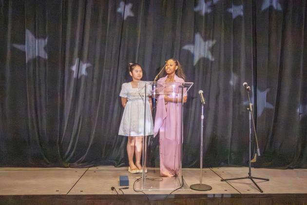 Members of the Boys and Girls Club lead the pledge of allegiance at the gala.