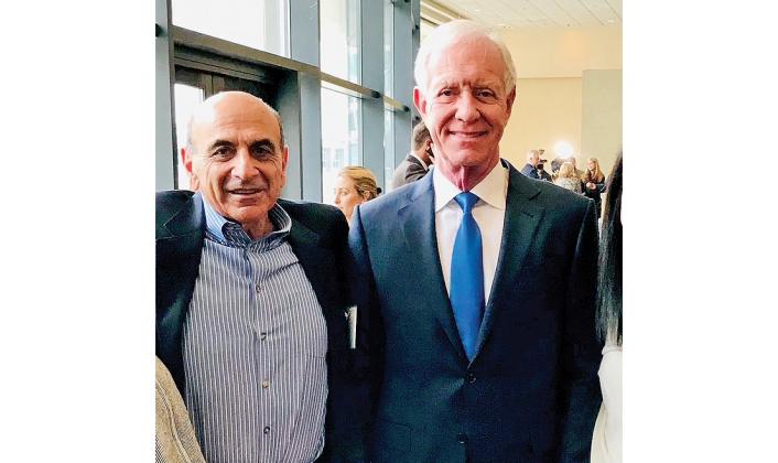 Carl Bazarian, left, stands with airline pilot Chesley "Sully" Sullenberger. Submitted photo