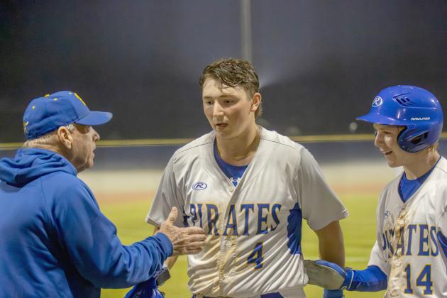 No. 4 Conner Bayless and No. 14 Eli Salyer celebrate after Bayless hit a sacrifice RBI. Photo by Ashley Chandler/News-Leader