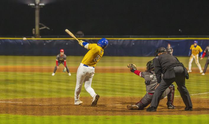 Trace Farmer hits the game-winning RBI in extra innings Feb. 13 against Baldwin. Photo by Ashley Chandler/News-Leader