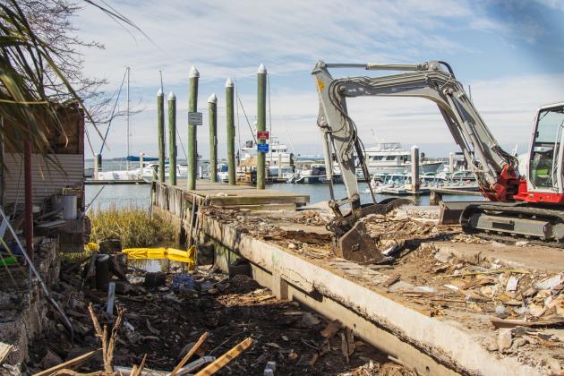 Atlantic Seafood partially demolished Wednesday at the Downtown Fernandina Beach Marina. Photo by Ashley Chandler/News-Leader