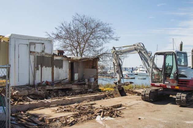 Atlantic Seafood partially demolished Wednesday at the Downtown Fernandina Beach Marina. Photo by Ashley Chandler/News-Leader