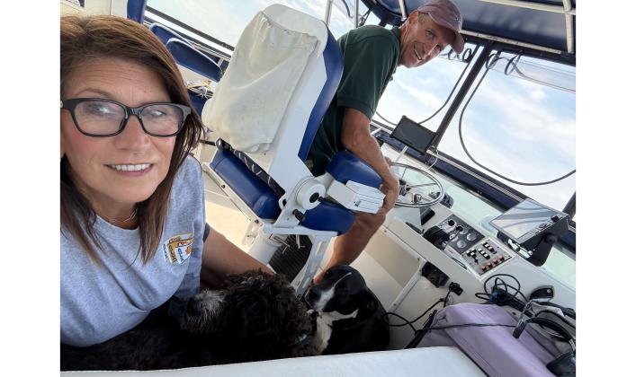 Mike and Suzanne Doran take a selfie with their two large dogs Roxy and Bodie in Pied à Mer, their 45’ Tollycraft CPMY power boat. Submitted photo