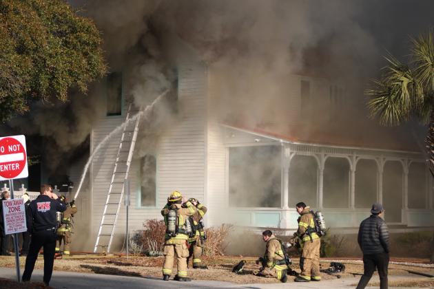 Smoke engulfs Isola Home in Fernandina as firefighters battle flames. By Marisa DeMar 