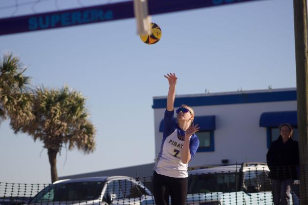 Fernandina Beach’s Olivia Rousselow serves the ball in a beach volleyball match Monday against Clay. Photo by Marisa DeMar/News-Leader