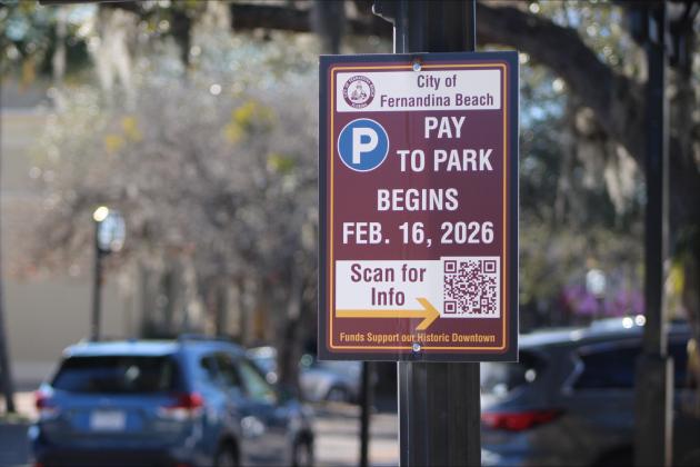 Paid parking signs posted in downtown Fernandina Beach. Marisa DeMar/News-Leader