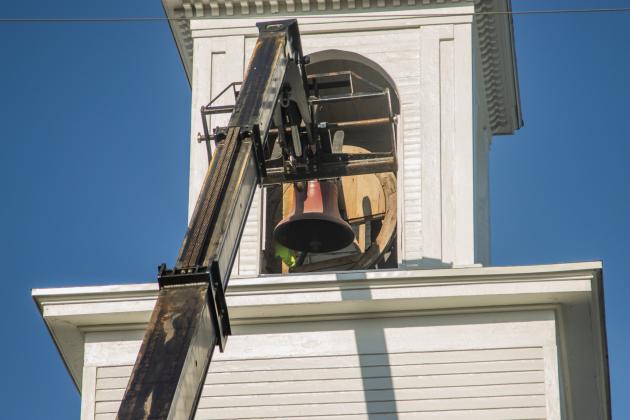 Workers from White’s Clock &amp; Carillon removed the bell from the belfry at First Presbyterian Church on 6th Street in downtown Fernandian Beach. The bell was first hung in 1859. Photo by Ashley Chandler/News-Leader