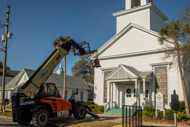 Workers from White’s Clock &amp; Carillon removed the bell from the belfry at First Presbyterian Church on 6th Street in downtown Fernandian Beach. The bell was first hung in 1859. Photo by Ashley Chandler/News-Leader