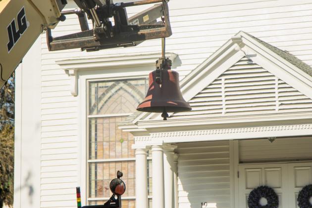 Workers from White’s Clock &amp; Carillon removed the bell from the belfry at First Presbyterian Church on 6th Street in downtown Fernandian Beach. The bell was first hung in 1859. Photo by Ashley Chandler/News-Leader