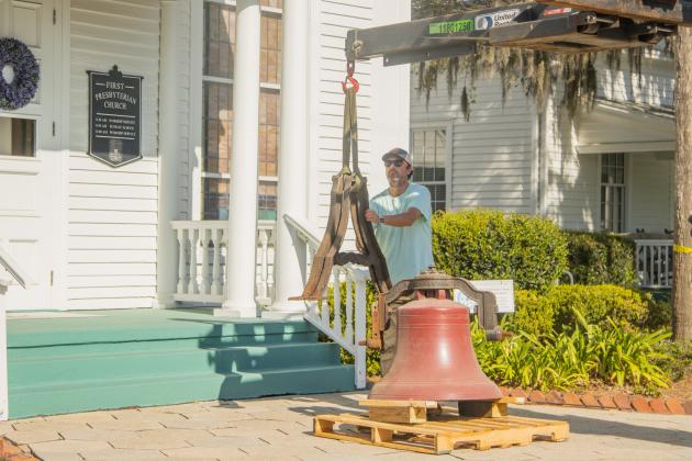 Workers from White’s Clock &amp; Carillon removed the bell from the belfry at First Presbyterian Church on 6th Street in downtown Fernandian Beach. The bell was first hung in 1859. Photo by Ashley Chandler/News-Leader