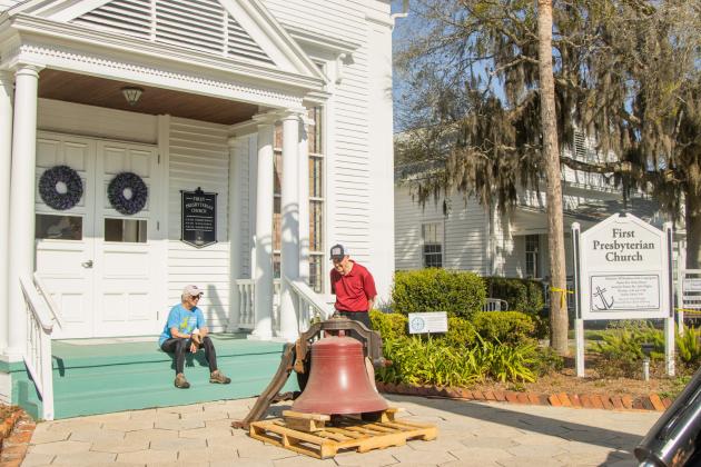 Workers from White’s Clock &amp; Carillon removed the bell from the belfry at First Presbyterian Church on 6th Street in downtown Fernandian Beach. The bell was first hung in 1859. Photo by Ashley Chandler/News-Leader