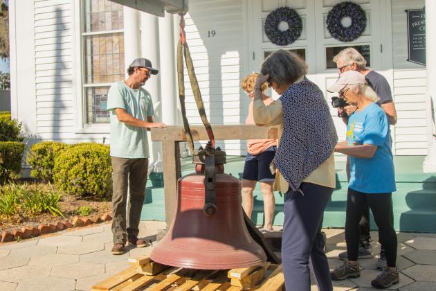 Workers from White’s Clock &amp; Carillon removed the bell from the belfry at First Presbyterian Church on 6th Street in downtown Fernandian Beach. The bell was first hung in 1859. Photo by Ashley Chandler/News-Leader