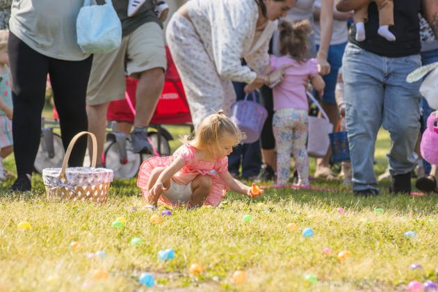 Thousands of colorful plastic eggs were scattered at Central Park on Saturday for local children to gather as part of Fernandina Beach’s second annual Easter Egg Hunt. Photo by Ashley Chandler/News-Leader