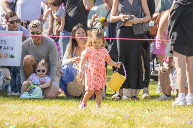 Thousands of colorful plastic eggs were scattered at Central Park on Saturday for local children to gather as part of Fernandina Beach’s second annual Easter Egg Hunt. Photo by Ashley Chandler/News-Leader