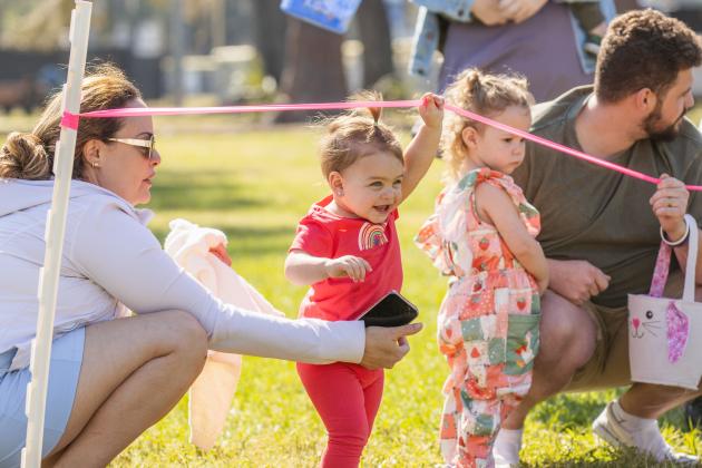 Thousands of colorful plastic eggs were scattered at Central Park on Saturday for local children to gather as part of Fernandina Beach’s second annual Easter Egg Hunt. Photo by Ashley Chandler/News-Leader