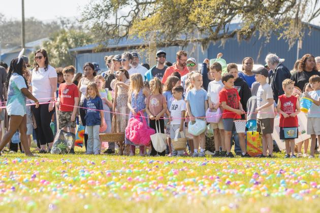 Thousands of colorful plastic eggs were scattered at Central Park on Saturday for local children to gather as part of Fernandina Beach’s second annual Easter Egg Hunt. Photo by Ashley Chandler/News-Leader