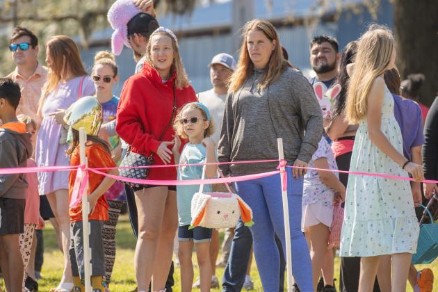 Thousands of colorful plastic eggs were scattered at Central Park on Saturday for local children to gather as part of Fernandina Beach’s second annual Easter Egg Hunt. Photo by Ashley Chandler/News-Leader