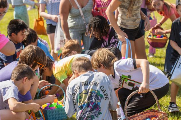 Thousands of colorful plastic eggs were scattered at Central Park on Saturday for local children to gather as part of Fernandina Beach’s second annual Easter Egg Hunt. Photo by Ashley Chandler/News-Leader