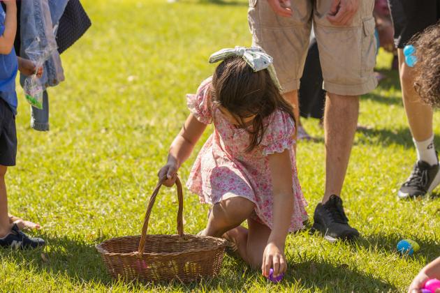 Thousands of colorful plastic eggs were scattered at Central Park on Saturday for local children to gather as part of Fernandina Beach’s second annual Easter Egg Hunt. Photo by Ashley Chandler/News-Leader