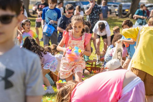 Thousands of colorful plastic eggs were scattered at Central Park on Saturday for local children to gather as part of Fernandina Beach’s second annual Easter Egg Hunt. Photo by Ashley Chandler/News-Leader